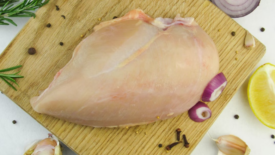 raw chicken on cutting board