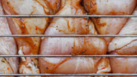 raw chicken on grill