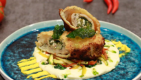 breaded stuffed chicken product on a plate