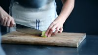 cook cutting onion