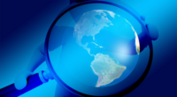 digital illustrationn of a blue person holding a giant magnifying glass focused on the world