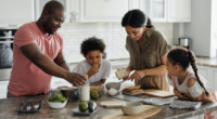 family of four cooking together