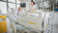 nurse caring for a patient in a hospital