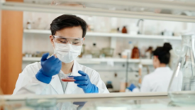 scientist with petri dish