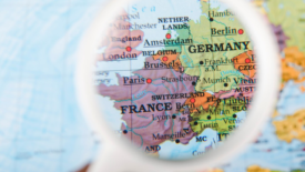 EU countries on map seen through magnifying glass