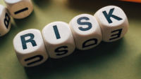 boggle tiles spelling out the word risk