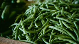 green string beans in brown crate