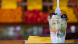 parfait in plastic cup with plastic fork