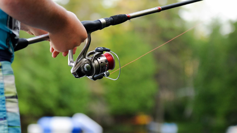 person using a fishing rod