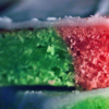 slice of a multicolored piece of cake up close