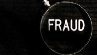 the word fraud under a magnifying glass