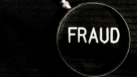 the word fraud under a magnifying glass