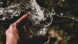 water splashing out of a glass