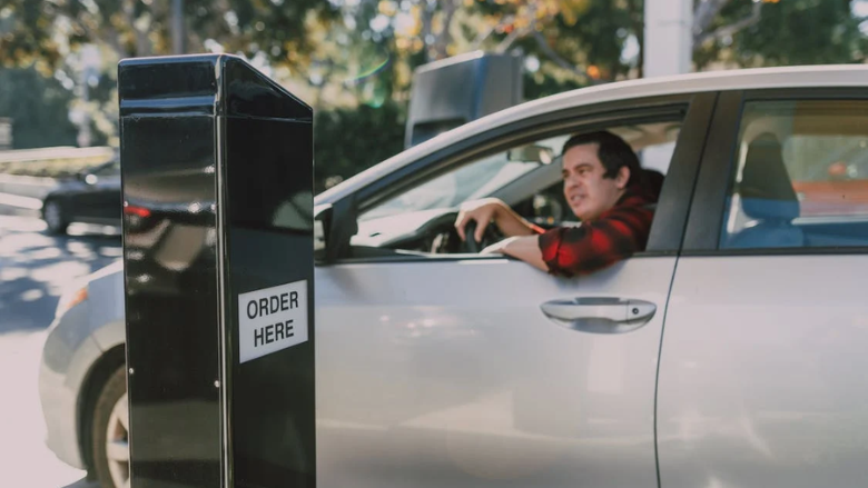 Customer inside a Car ordering at a Drive Thru