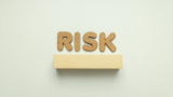 corkboard letters spelling risk