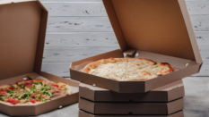 pizzas in carboard takeout boxes