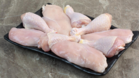 raw chicken breasts and drumsticks