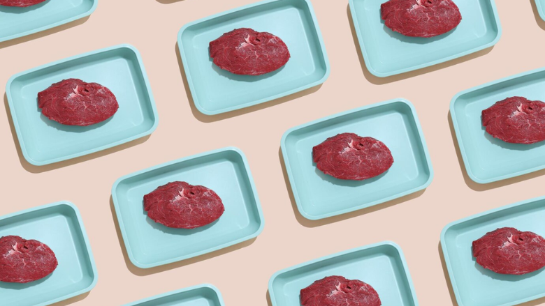 raw red meat in blue trays