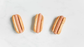 three hot dogs on buns plain