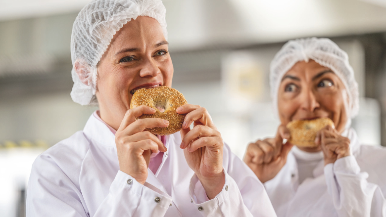 baker eating bagel made with DeutscheBack TopBake Fresh and Taste