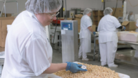 food factory worker checking product