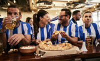 sports fans eating at a bar