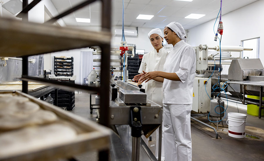 one food processor training another in bakery