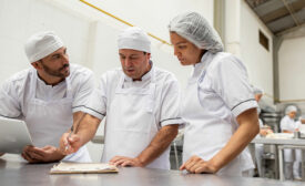 food line workers and safety managers collaborating