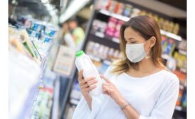 Woman reading milk label